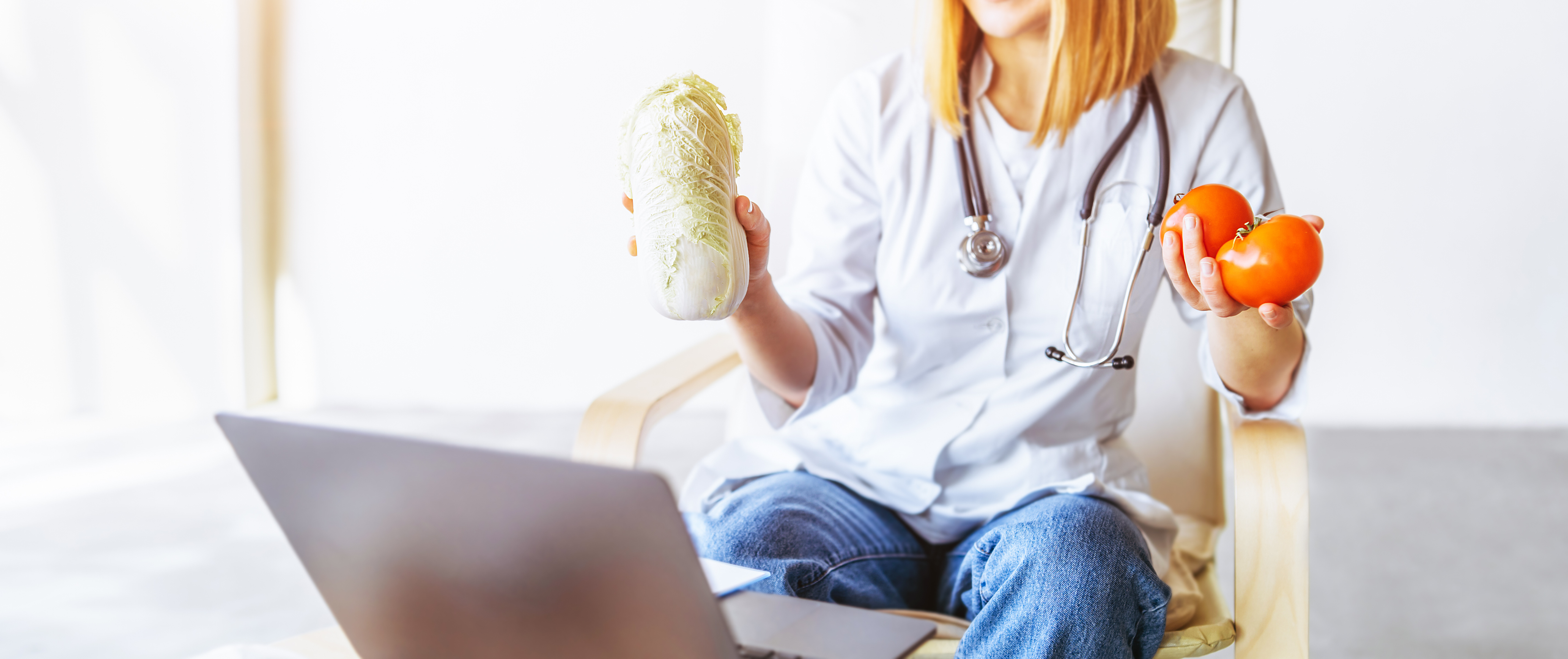 Doctor Holding Vegetables During Online Consultation